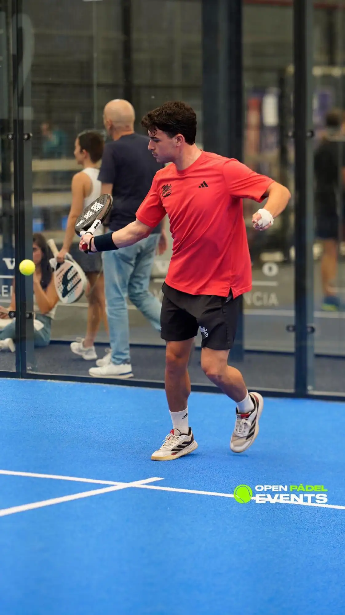Padel players in the middle of a point